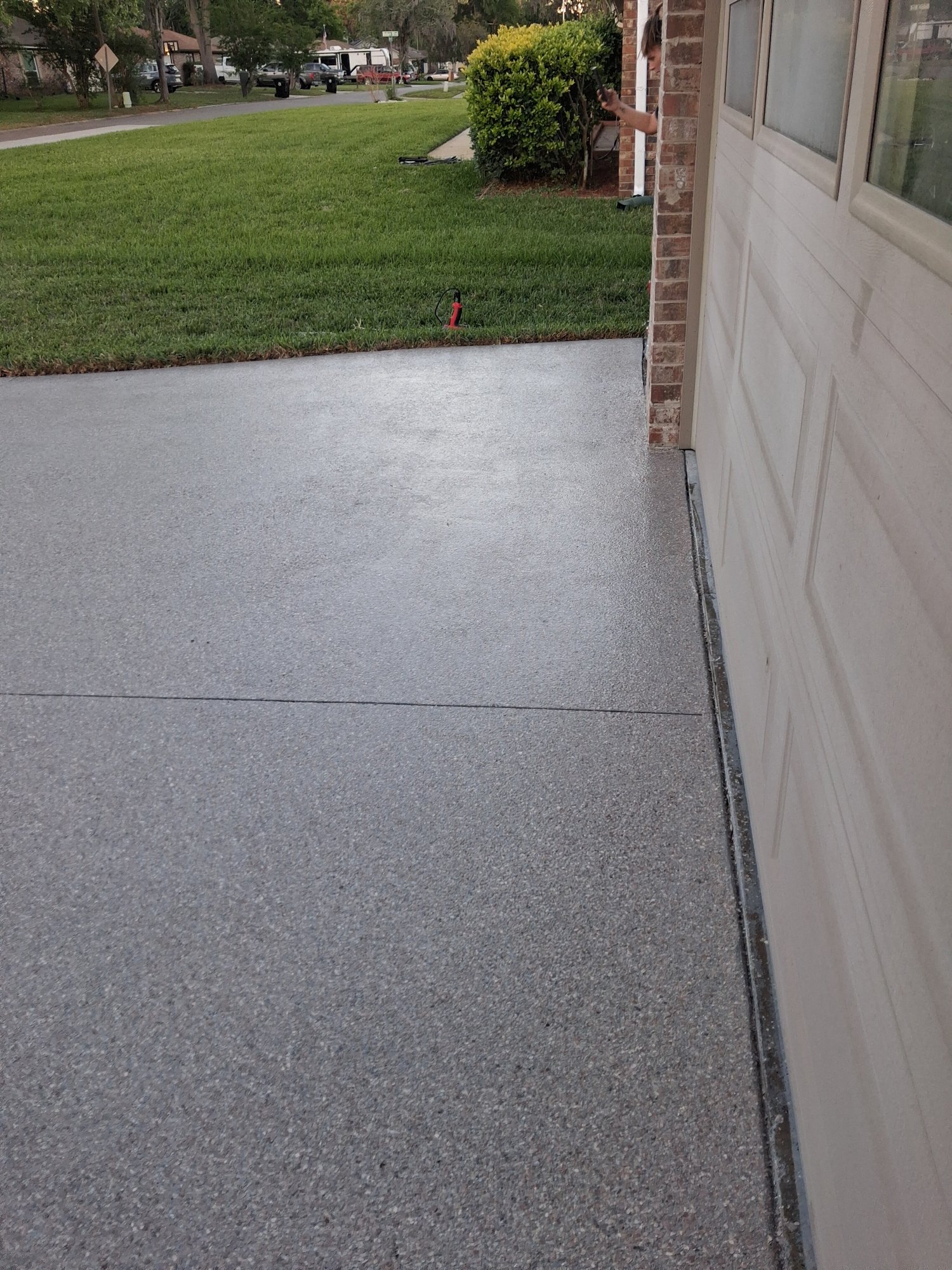 Finished grey-and-cream flake driveway at dusk