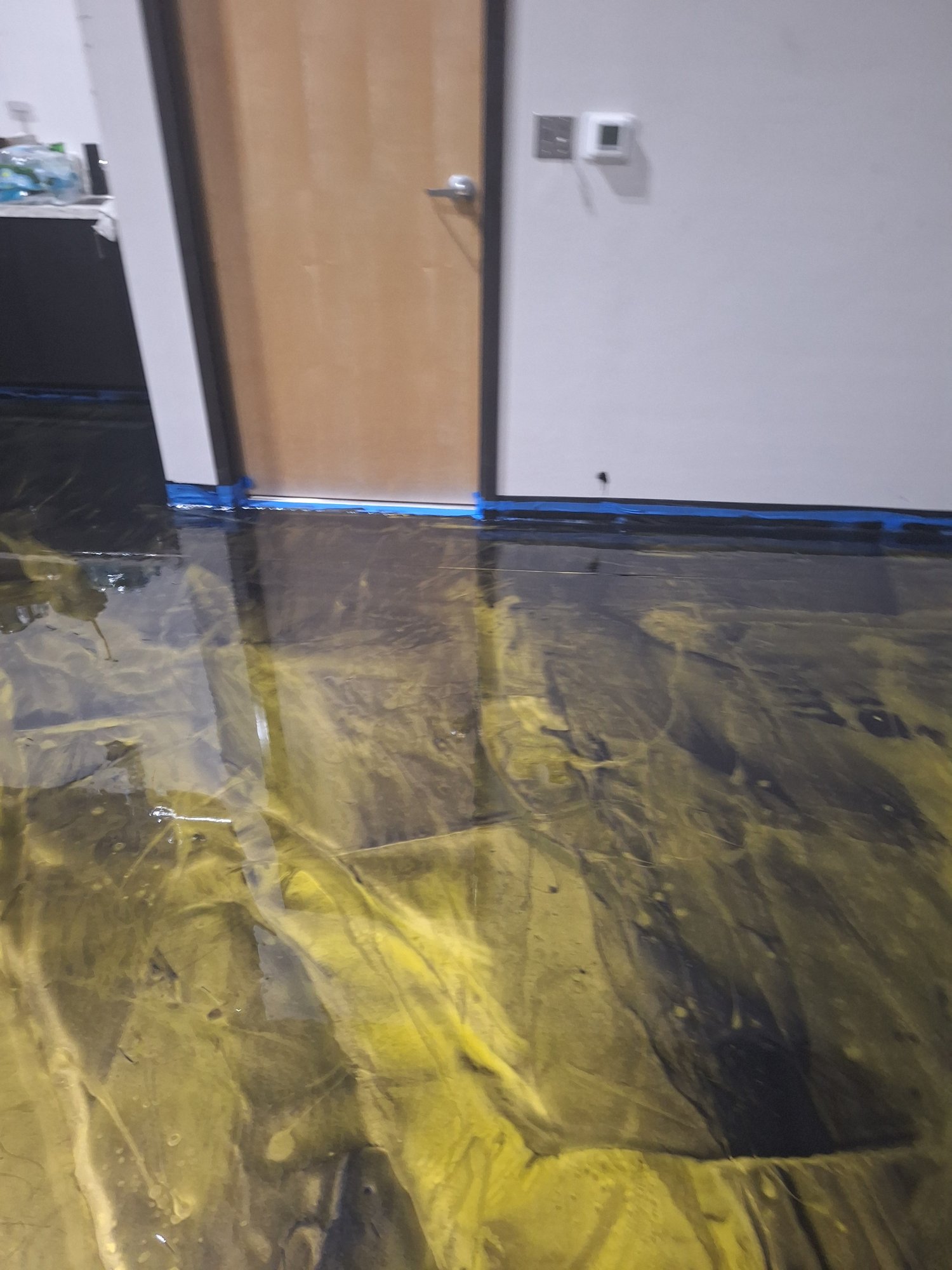 Yellow and black metallic warehouse floor with pallet racking